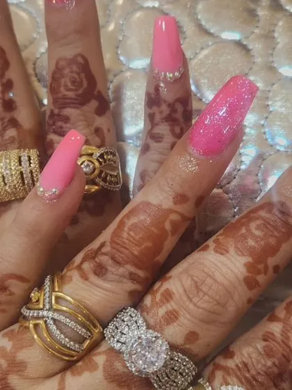 Go bold with this vibrant pink manicure on long, square extensions. I used a mix of glitter and rhinestones to create a super sparkly, eye-catching look.