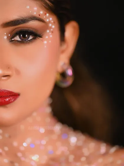 A close-up artistic beauty portrait focusing on creative makeup with pearl and glitter details. This high-fashion shot highlights my ability to work with makeup artists to create striking visuals for model portfolios.