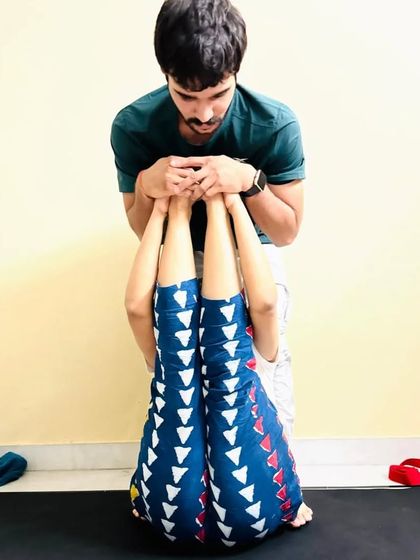 This perspective shows how I support the legs in a supine stretch, ensuring the lower back stays grounded and the stretch is effective.