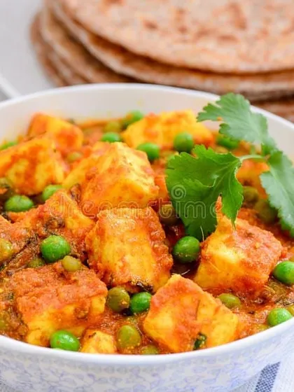 A classic North Indian delicacy, our Matar Paneer is a must-have for any celebration. We use soft paneer cubes and sweet green peas in a homestyle gravy that pairs perfectly with our fresh rotis.
