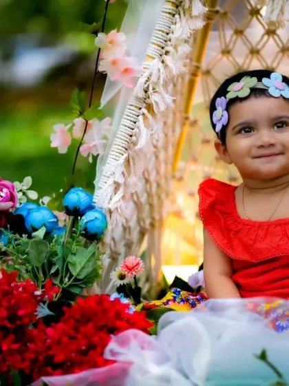 A vibrant and colorful floral setup for an outdoor baby shoot. The natural light makes the flowers look even more beautiful.