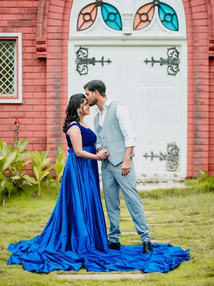 We find magic in unique locations, like this charming chapel-style building. The vibrant blue of her gown creates a beautiful contrast, making for a truly fairytale-like pre-wedding portrait.