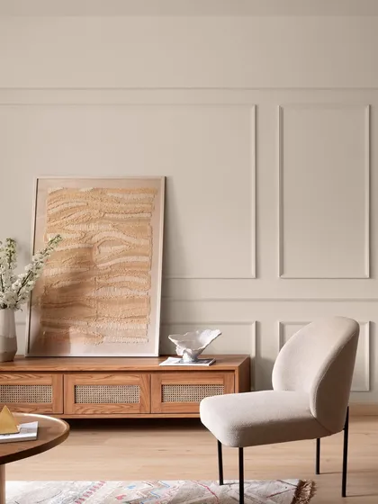 This living room from "Apartment 222" feels like a warm hug. We used a palette of soft, earthy tones and natural materials like wood and linen, with classic wall molding to add a touch of timeless elegance. The space is calm, balanced, and elevated.