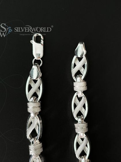 A close-up detail of the X-Link bracelet's craftsmanship. You can see the precision in the textured links and the sturdy construction of the clasp mechanism, ensuring durability.