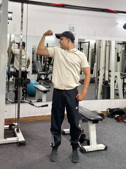 Standing flex in the gym.