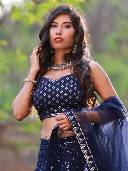 A powerful, confident pose that showcases the entire look. This image is perfect for a model's portfolio, demonstrating their ability to convey different emotions and styles.