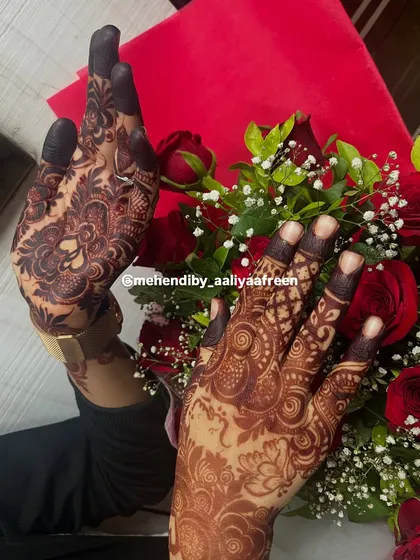 Oh to have this stain! A beautiful dark henna result, perfectly complemented by a bouquet of red roses.