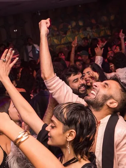 The joy on the dance floor is everything. This shot from my Bollywood Disco party captures that moment of pure release and connection that I strive to create, where everyone feels free to let go and celebrate together.