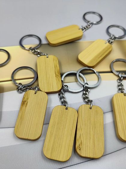 A collection of our bamboo keychains, ready for bulk orders and custom branding. These lightweight and durable key rings are a simple yet effective eco-friendly promotional item or corporate giveaway.