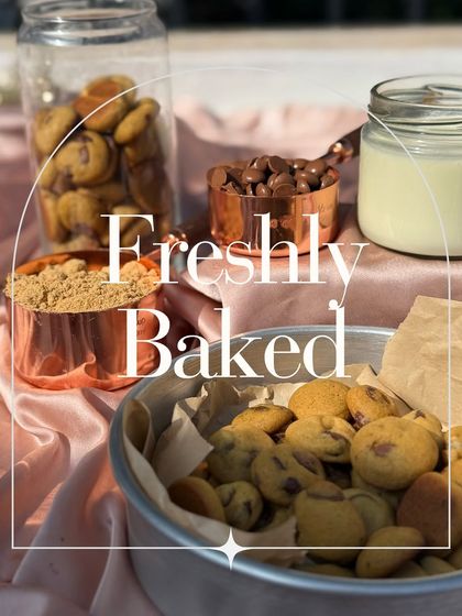Freshly baked mini chocolate chip cookies, straight from my oven. This beautiful flat lay shows them ready to be enjoyed with a glass of milk, perfect for a mid-day snack or midnight binge.