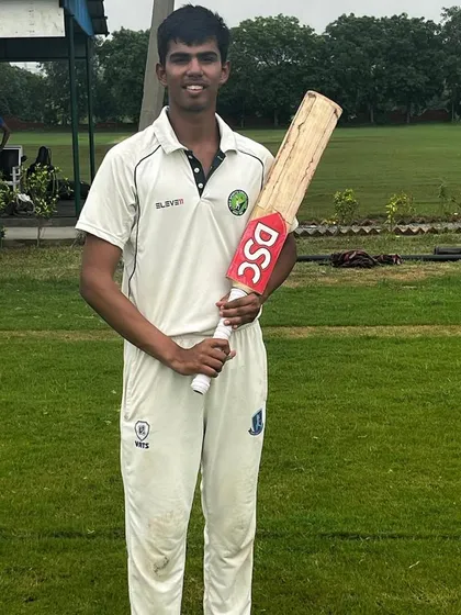 Shreyansh Karnwal holds his bat with pride after scoring an unbeaten century for the U19 team. His performance is a shining example of the talent being developed at our academy.