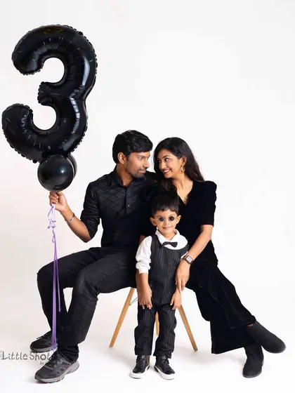 Marking a special milestone with a fun birthday photoshoot. This family is celebrating their little one turning three, complete with a number balloon and stylish coordinated outfits. It’s a wonderful way to freeze a moment in time.