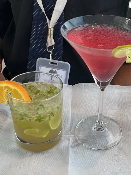 A duo of our popular cocktails: a classic mojito and a vibrant pink cosmopolitan. We offer a wide range to suit every palate.