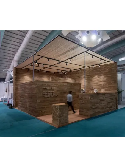 The exterior of the Aquant stall, a simple yet elegant cube made of cardboard, stands out in the busy exhibition hall.