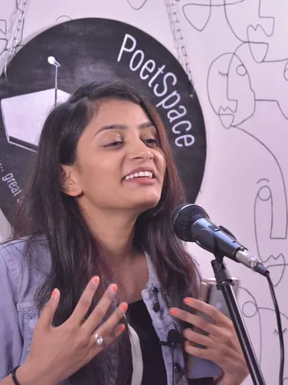 A moment of expressive performance. Sharing my shayari allows me to connect with people on a different, more personal level.