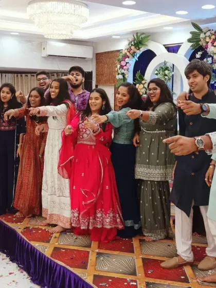 The friends of the couple pointing and cheering, fully engaged in the fun and games.