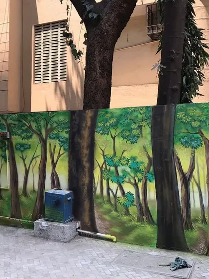 The completed forest path mural, seamlessly integrating with the surrounding environment.