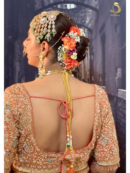 The final look, with the floral bun and passa perfectly framing the bride's profile.