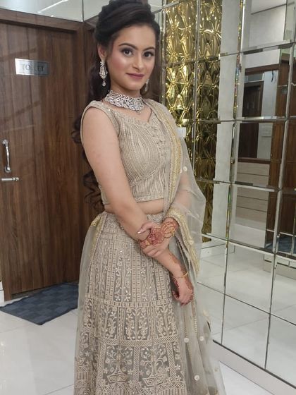 This client looks graceful in a light gold embroidered lehenga. It’s a versatile rental that can be dressed up or down for any festive occasion.