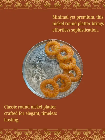 For a minimal yet premium look, this classic round nickel platter is perfect. Its timeless design and elegant etching make it ideal for serving anything from jalebis to canapés.