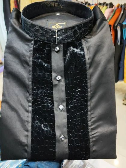 A close-up of my Nawab Poshak Kurta in jet black. This design features a unique crocodile-textured panel on the placket and collar, available in sizes up to 5XL.
