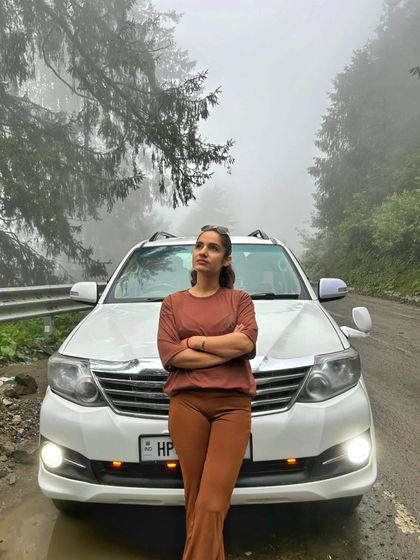 A moment of stillness on a mountain road, with the fog creating a mystical backdrop. This is the perfect weather for introspection and quiet contemplation.