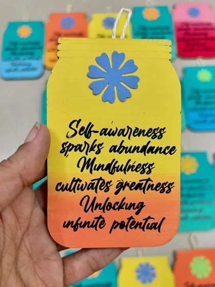 A yellow and orange version of the custom motivational hanging, perfect for adding a splash of color.