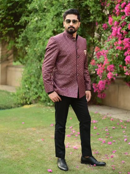 The versatile wine-colored bandhgala jacket, a statement piece that combines traditional Indian tailoring with modern style.