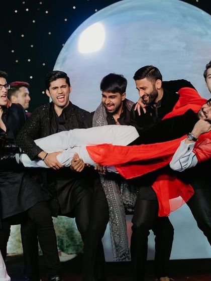 The boys are here to steal the show. A fun and dramatic moment from the groomsmen's act.