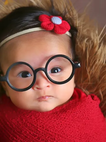 For the family of Harry Potter fans, we had to add a touch of magic. A simple pair of round glasses on this alert little wizard-in-training created a playful and memorable portrait that shows off their personality.