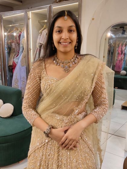 This client looks lovely in a subtle gold lehenga, paired with a delicate antique-finish necklace. A great choice for a bridesmaid or for a smaller function.