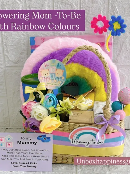 Celebrate the mom-to-be with a burst of color and joy. This rainbow-themed baby shower hamper includes a plush rainbow cushion, pampering items, and a sweet note from the baby bump, making it a truly heartwarming pregnancy gift.