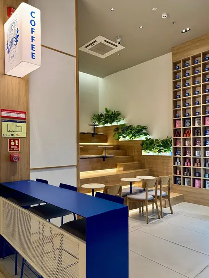 To translate the young, energetic vibe of the coffee brand Beanly into their first physical cafe, we designed this dynamic, multi-level stepped seating. This feature makes clever use of a compact, triple-height space, creating an informal and approachable lounge area that encourages customers to linger.