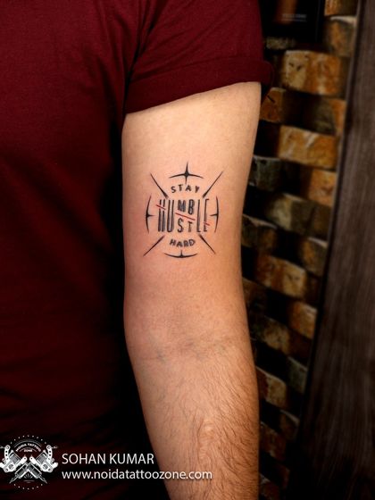 A finished look at the "Stay Humble, Hustle Hard" custom script tattoo. The design is clean, sharp, and carries a strong message.