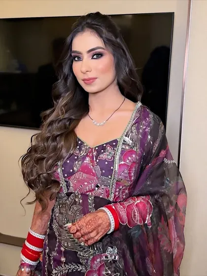 The complete look. The dramatic eye makeup is balanced with a soft pink lip and glowing skin, creating a look that is both bold and beautiful.