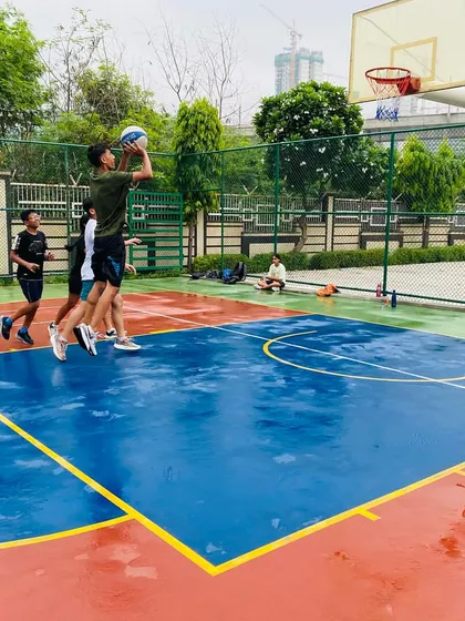 A player goes up for a layup, showing great elevation.