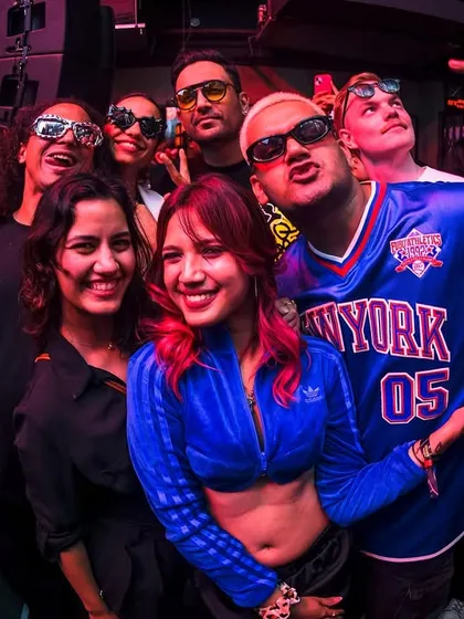 A group of friends posing for a photo, capturing the fun of the night.