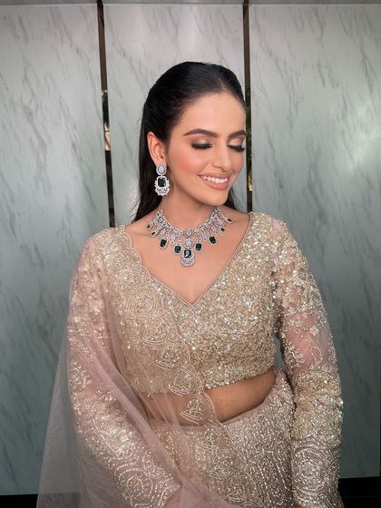 The bride's happy smile says it all. She looks absolutely radiant in her engagement attire.