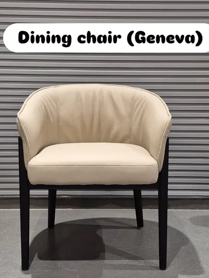 A frontal view of the beige 'Geneva' chair.