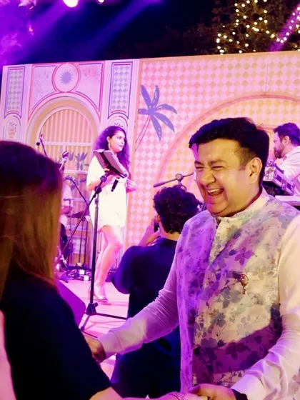 It's all about connection. We love interacting with the bride, groom, and their families, making them feel like part of the show. Here's a guest having a great time right by the stage.