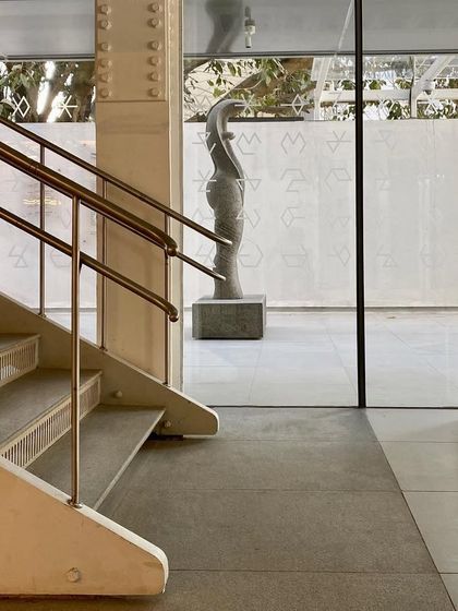 A view from the base of a staircase inside MAP, looking out into the sculpture court. The framing of views is a key part of our design.