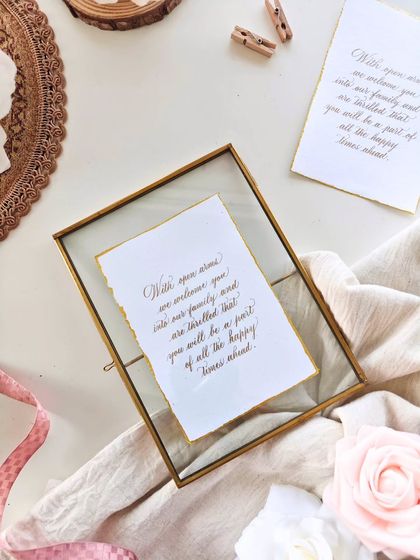 The welcome note displayed in a brass and glass frame, showing how these simple cards can also be presented as beautiful keepsakes.