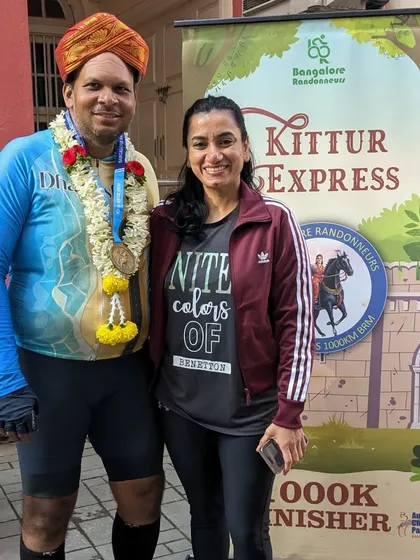 The finish line of the Kittur Express 1000K. After battling rain, heat, wind, and fog over 1000km, 17 riders conquered the brevet. Here, a finisher is welcomed by his proud family.