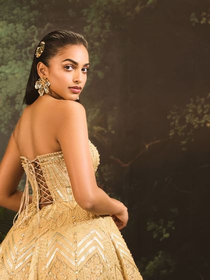 The back of the Jules Dress reveals its corset construction. The delicate lace-up detail is not just functional for a perfect fit but also adds a romantic, classic element to this modern dress.