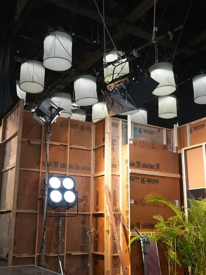 Another angle of the set, highlighting the layered lighting design with both decorative and functional fixtures.