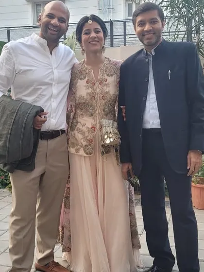 Posing with friends and family at the wedding. It's a joy to see everyone's curated outfits come together at the event.