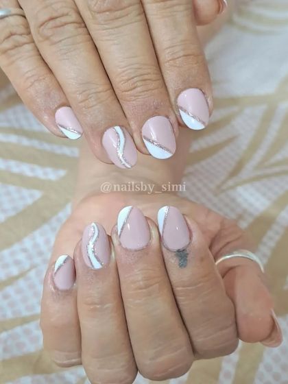 Simple yet beautiful baby pink nails with white and silver line details.