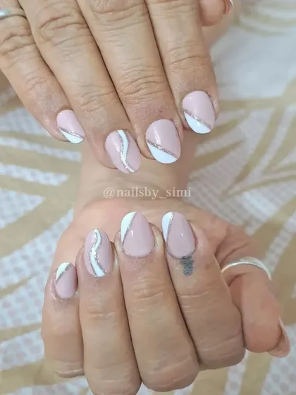 Simple yet beautiful baby pink nails with white and silver line details.