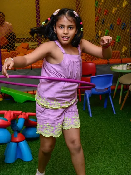 Bring it on! This girl is ready for any hula hoop challenge.