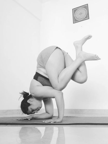 Bringing the legs into a tucked, crossed position in Pincha. This is an advanced variation that plays with balance in a new way.